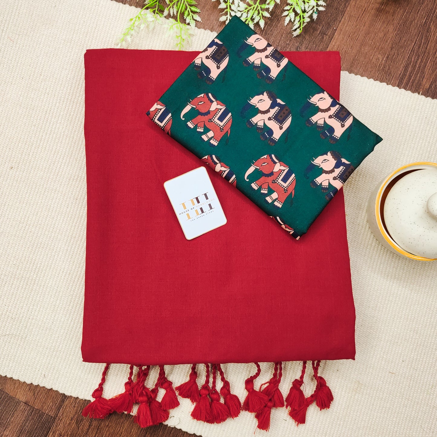 Sunset red saree with beautiful forest green elephant printed blouse