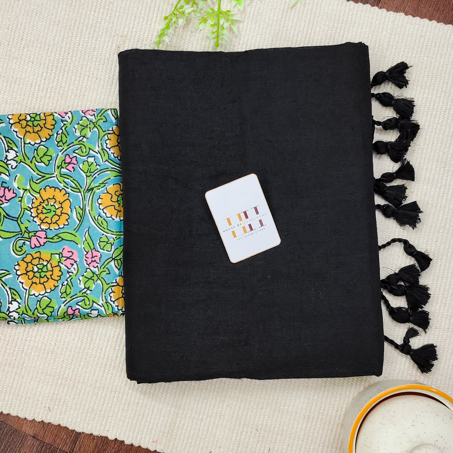 Royal black saree with sky blue flower printed blouse