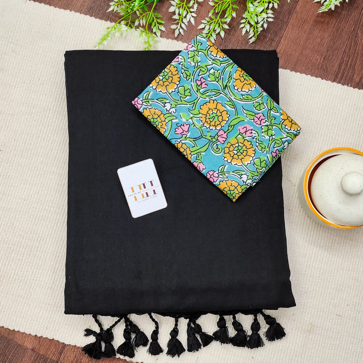 Royal black saree with sky blue flower printed blouse