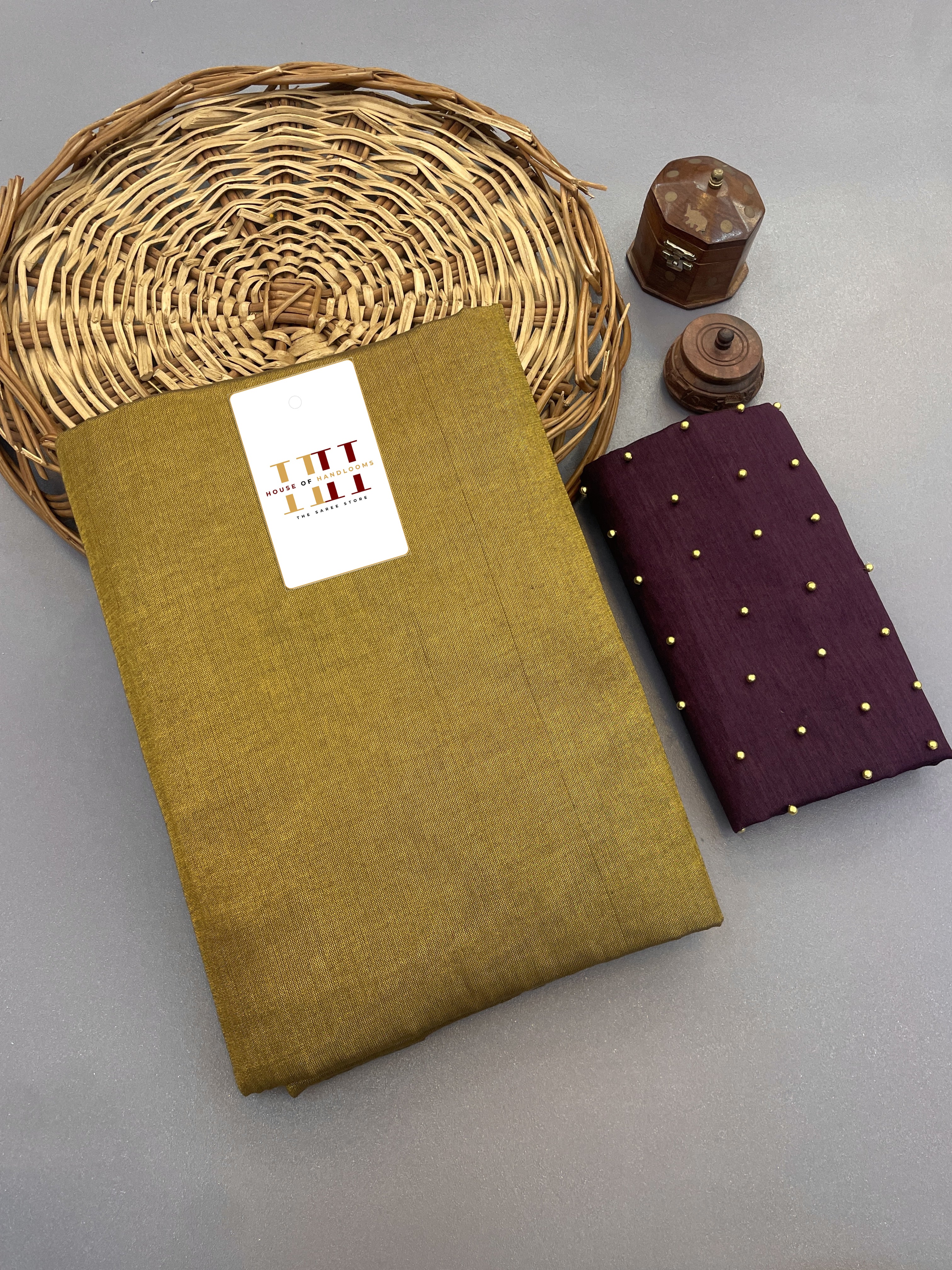Olive Tissue cotton saree with pearl work wine blouse