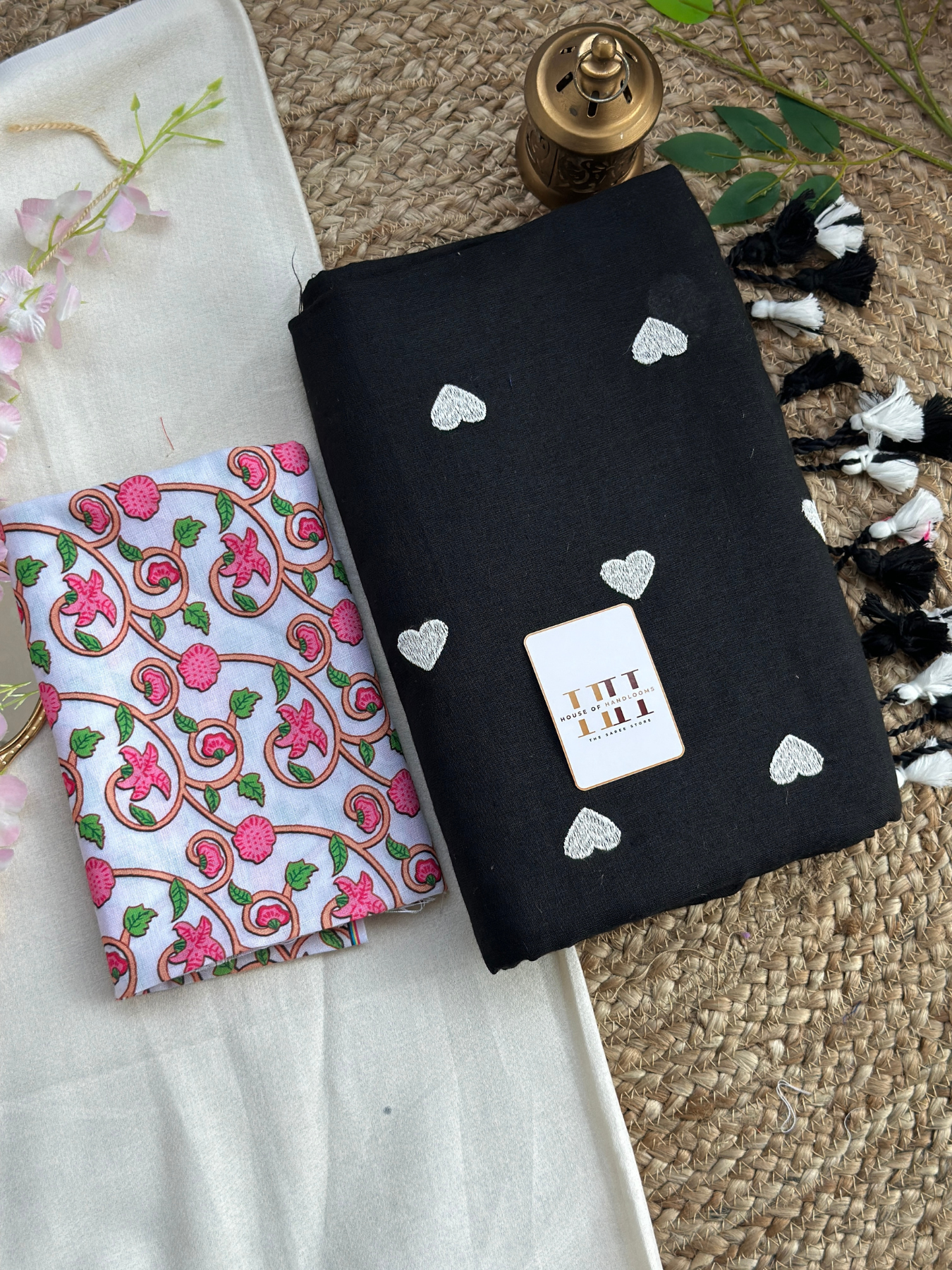 Rich black cotton handloom saree with white floral printed blouse