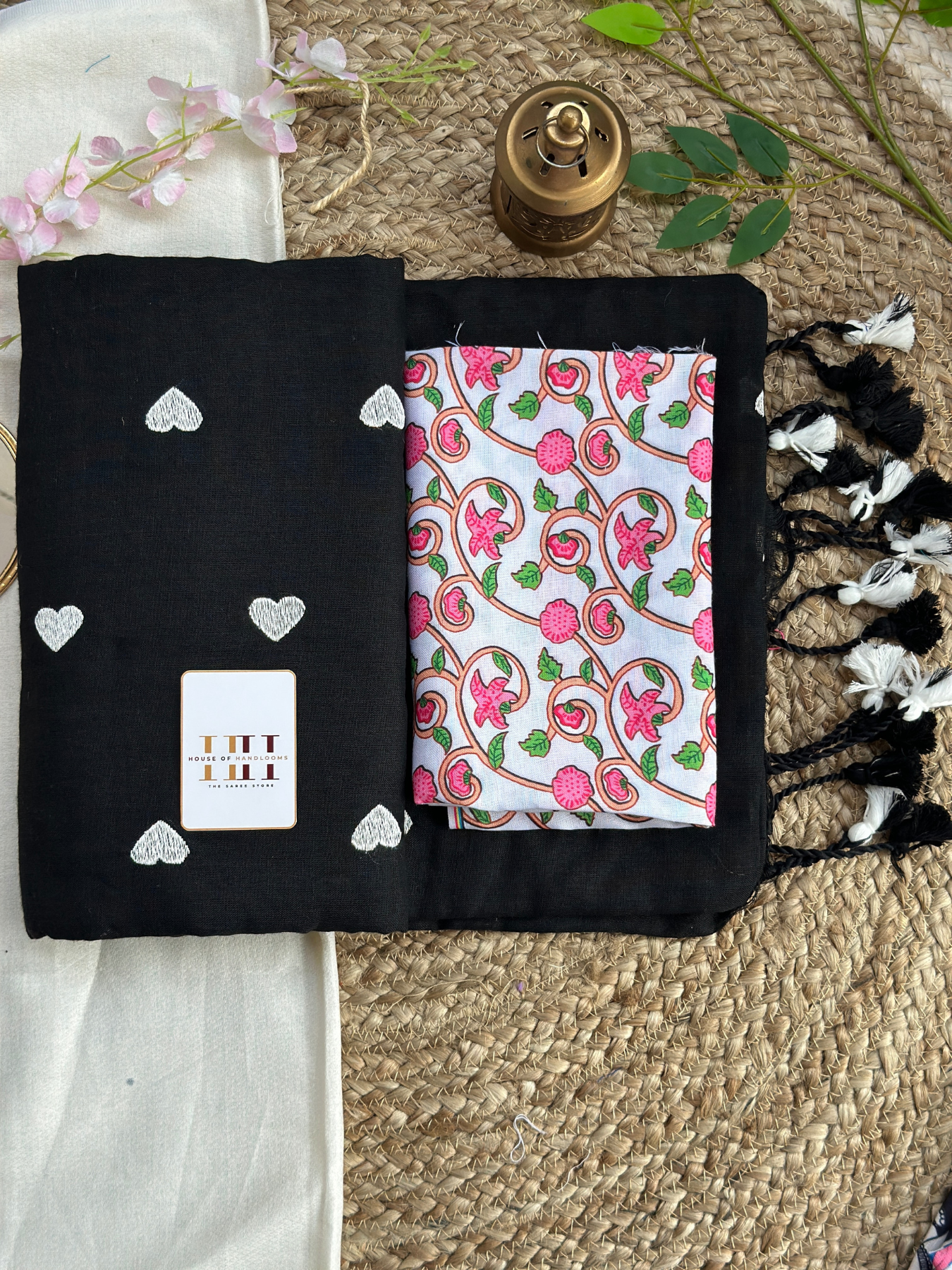Rich black cotton handloom saree with white floral printed blouse